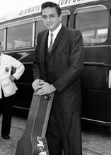 Johnny Cash poses with his guitar case 1959 London Airport 5x7 inch press photo