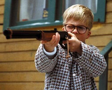 A Christmas Story Peter Billingsley as Ralphie aims Red Ryder air rifle 8x10