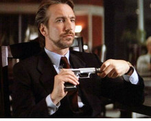 Alan Rickman screws silencer onto his gun as Hans Gruber Die Hard 8x10 photo