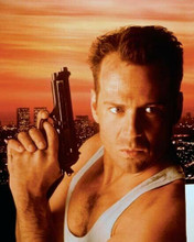 Bruce Willis as John McClane holding gun upright 8x10 photo Die Hard