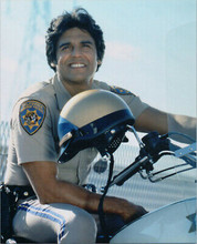 Chips 1970's TV series Erik Estrada sits astride patrol bike smiling 8x10 photo