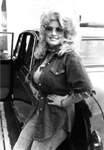 Dolly Parton huge bust leaning against car wearing sunglasses 1970's 5x7 photo