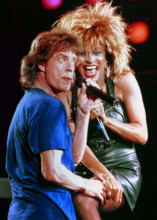 Mick Jagger touches leg of Tina Turner on stage both laughing 5x7 inch photo