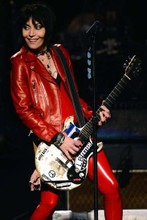Joan Jett smiling in red leather jacket and pants playing guitar 4x6 inch photo