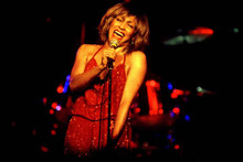 Tina Turner in red sequined dress sings in concert 4x6 inch photo