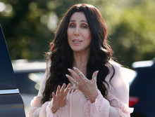 Cher candid pose in pink dress with many rings on her hands 12x12 inch photo