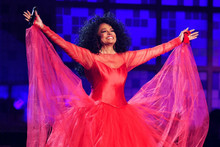 Diana Ross smiling in concert taking bow 12x18 poster in red dress