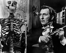 The Curse of Frankenstein Peter Cushing holds gun next to skeleton 12x18  Poster