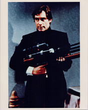 Timothy Dalton as James Bond holds telescopic rifle Living Daylights 8x10 photo