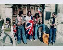 The Rolling Stones pose at The Alamo with flags 8x10 press photo