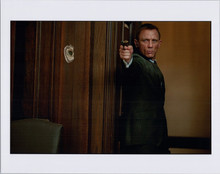 Daniel Craig aims gun as James Bond in Skyfall 8x10 photo