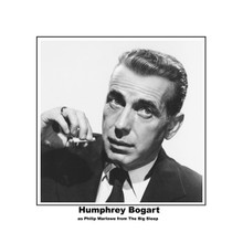 Humphrey Bogart in classic tough guy pose holding cigarette 8x10 photo