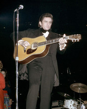 Johnny Cash 1969 in black outfit playing guitar on stage 8x10 photo