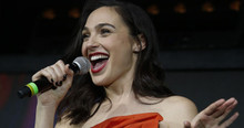 Gal Gadot smiling candid holding microphone on stage 8x10 photo
