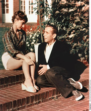 Sabrina 1954 movie Audrey Hepburn leggy pose seated next to Humphrey Bogart 8x10