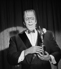 The Munsters Fred Gwynne as Herman smiling holding Emmy Award 8x10 photo