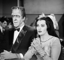 The Munsters Herman and Lily in formal dress sitting together 8x10 photo