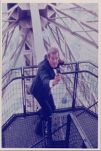 Roger Moore in action on Eiffel Tower 8x10 photo A View To A Kill