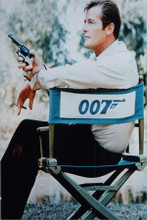 Roger Moore sits on Live and Let Die set in 007 chair 8x10 photo