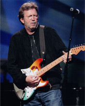 Eric Clapton 8x10 press photo in black jacket playing guitar on stage 1990's
