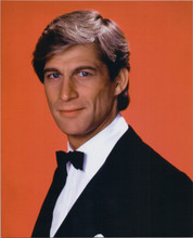 Manimal 1983 TV series Simon MacCorkindale in tuxedo red background 8x10 photo