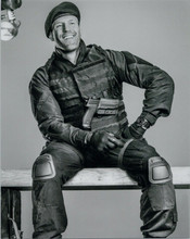 Jason Statham smiling 8x10 in combat fatigues sitting on bench The Expendables