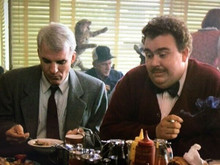 Planes Trains And Automobiles Steve Martin John Candy sit having lunch 8x10