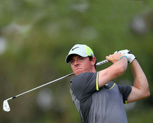 Rory McIlroy swinging golf club wearing cap 8x10 Photo