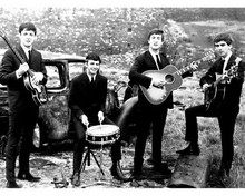 THE BEATLES JOHN PAUL RINGO & GEORGE WITH INSTRUMENTS BY OLD CAR 8X10 PHOTO