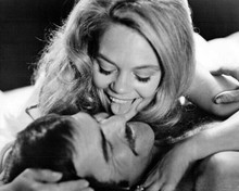 Shamus 1973 8x10 inch photo Dyan Cannon licks the face of Burt Reynolds in bed