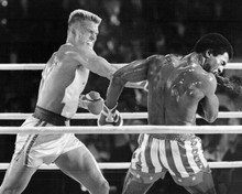 Rocky IV 8x10 inch photo Dolph Lundgren as Drago punches Carl Weathers as Creed