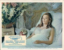 Leslie Caron lies in bed in white nightdress as Fanny 8x10 photo
