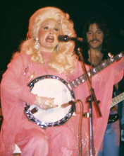 Dolly Parton 1970's in concert pose seated playing banjo on stage 8x10 photo