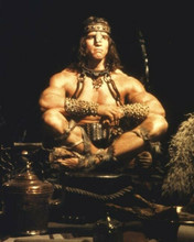 Arnold Schwarzenegger as Conan the Barbarian sitting cross-legged 8x10 photo