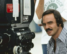 Burt Reynolds in checkered shirt behind camera on set 8x10 inch photo