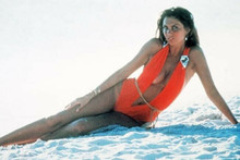 Caroline Munro wears brief red swimsuit on beach 4x6 inch photo