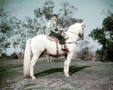 Debbie Reynolds sits astride white horse circa early 1950's 8x10 inch photo