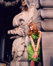 Francoise Dorleac poses in green dress by statues 1967 8x10 inch photo