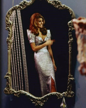 Raquel Welch 1968 pose in clingy silver gown looks in mirror 8x10 inch photo