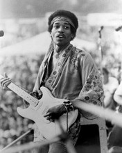 Jimi Hendrix playing his guitar at outdoor concert 8x10 inch photo