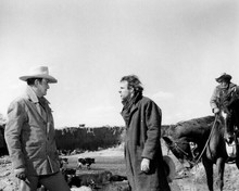 The Cowboys John Wayne with cattle faces off against Bruce Dern 8x10 inch photo