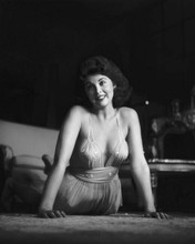 Tina Louise in low cut dress poses on floor smiling 8x10 inch photo