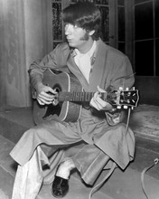 The Monkees Peter Tork in robe and slippers playing guitar 8x10 inch photo