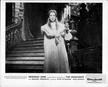 The Innocents Deborah Kerr holds candle at bottom of staircase 8x10 inch photo