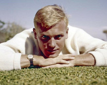 Tab Hunter in white sweater lies on grass publicity portrait 8x10 inch photo