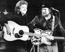 Johnny Cash Waylon Jennings play guitars on stage 1980's 8x10 inch photo