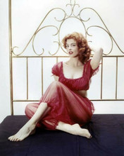 Tina Louise Gilligan's Ginger in red two piece outfit on bed 8x10 inch photo