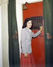 Gail Russell 1940's pose standing by red door 8x10 inch photo