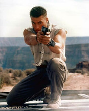 Jean Claude Van Damme points gun whilst handcuffed 8x10 inch photo