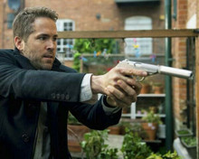 Ryan Reynolds pointing his gun The Hitman's Wife's Bodyguard 8x10 inch photo